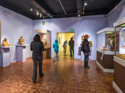 Visitors stroll the latest exhibition at USC Pacific Asia Museum