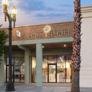 Photo of storefront of Sweet Flower in Pasadena at dusk with street light on.