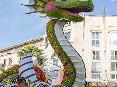 Floral-decorated Rose Parade float of giant dragon, travels down Colorado Boulevard in Playhouse Village. Photo Credit: Visit Pasadena