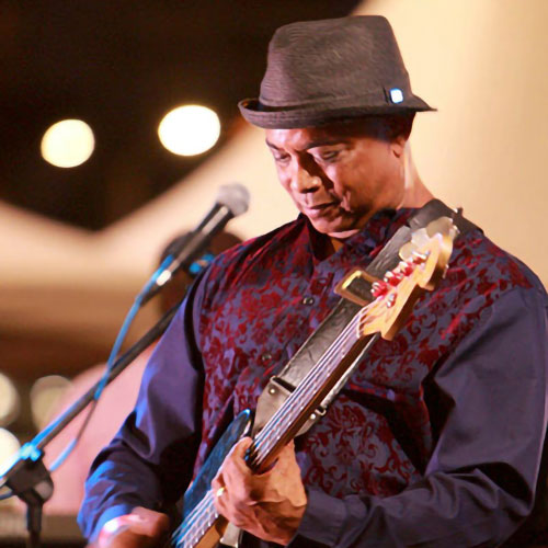 Michael Haggins plays the guitar at a concert