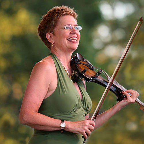 Susie Hansen plays the violin at an outdoor concert