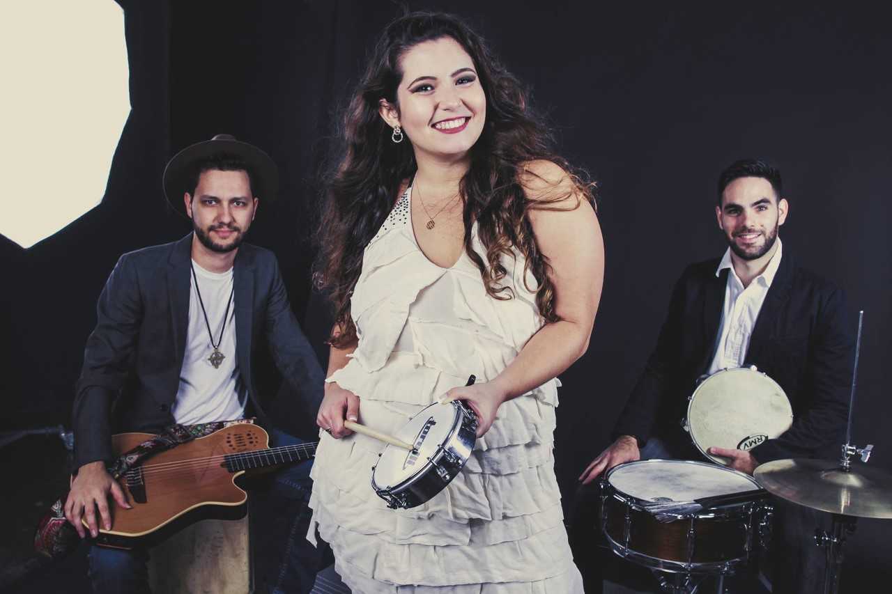 Group Little Brazil poses with instruments with vocalist Natalia in the center