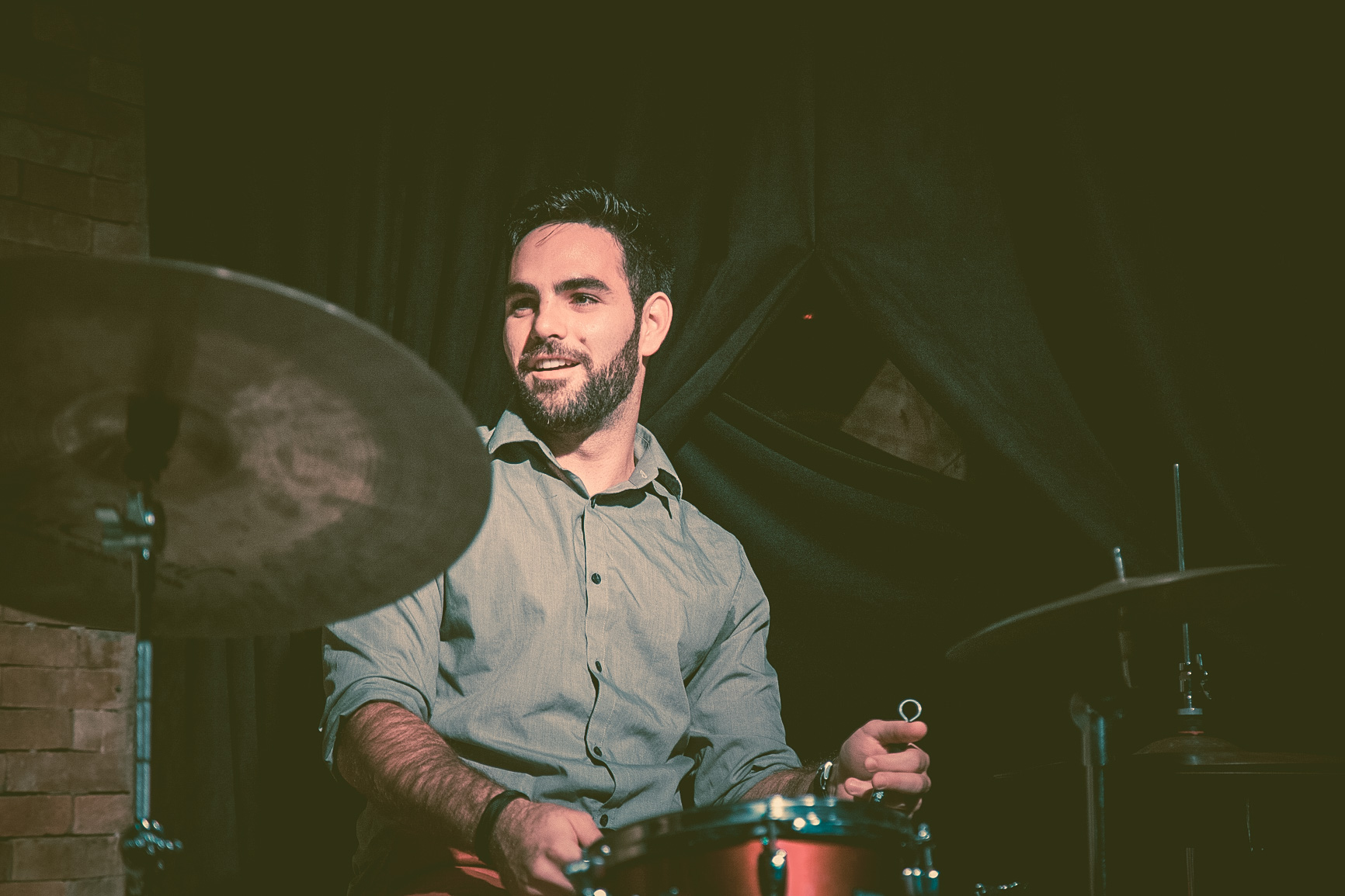 Marcelo Bucater plays the drums at a concert