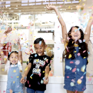 Children celebrate the new year with confetti