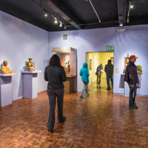 Visitors explore the latest exhibition at USC Pacific Asia Museum