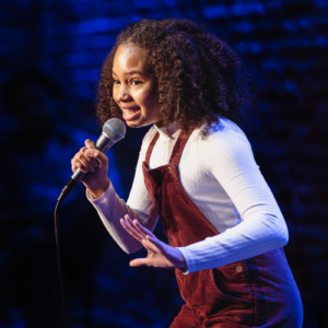 Young girl performs stand up comedy set at Ice House Comedy Club