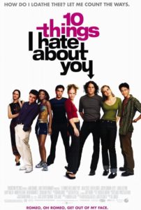 Movie poster of the film 10 Things I Hate About You features the young assemble standing together looking at camera. The top of the poster says: How Do I Loathe Thee? Let Me Count The Ways.