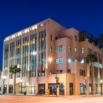 Evening photo of the modern art deco building of Playhouse Plaza on Colorado Blvd in Pasadena.